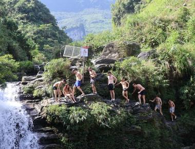 Tourists Queue to Jump at Du Gia Waterfall in Ha Giang